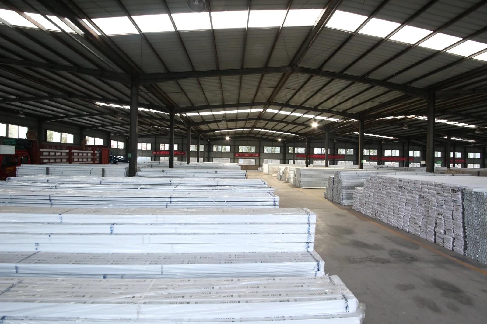 Massive Ready-to-ship uPVC profiles stack in warehouse